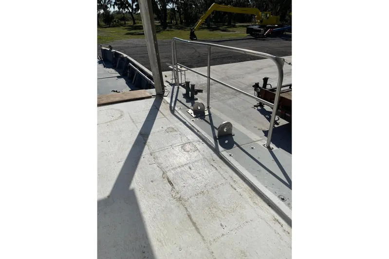 Asi Tender Yacht Photos Pics 1987 Commercial Buoy Tender deck with metal railing and outdoor equipment.