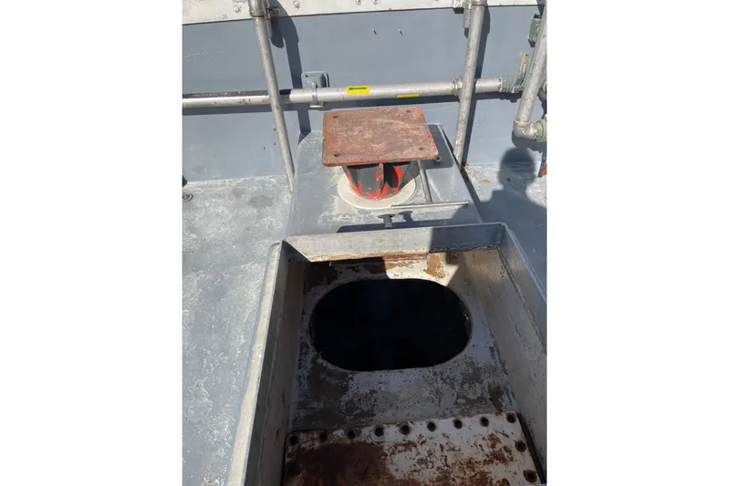 Asi Tender Yacht Photos Pics 1987 Commercial Buoy Tender deck with open hatch and metal structures.