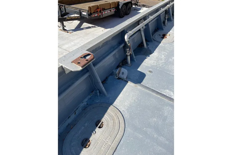 Asi Tender Yacht Photos Pics 1987 Commercial Buoy Tender deck with metal fittings and pipes.