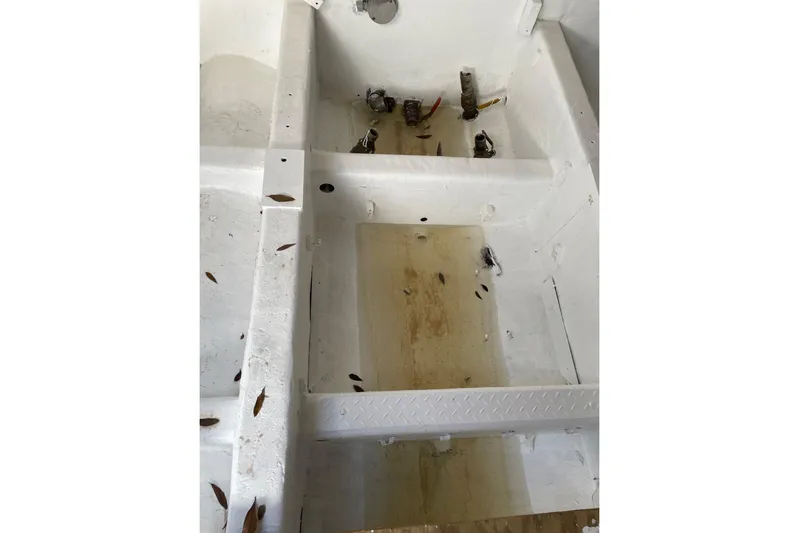 Asi Tender Yacht Photos Pics Interior of a 1987 commercial buoy tender with visible pipes and debris.