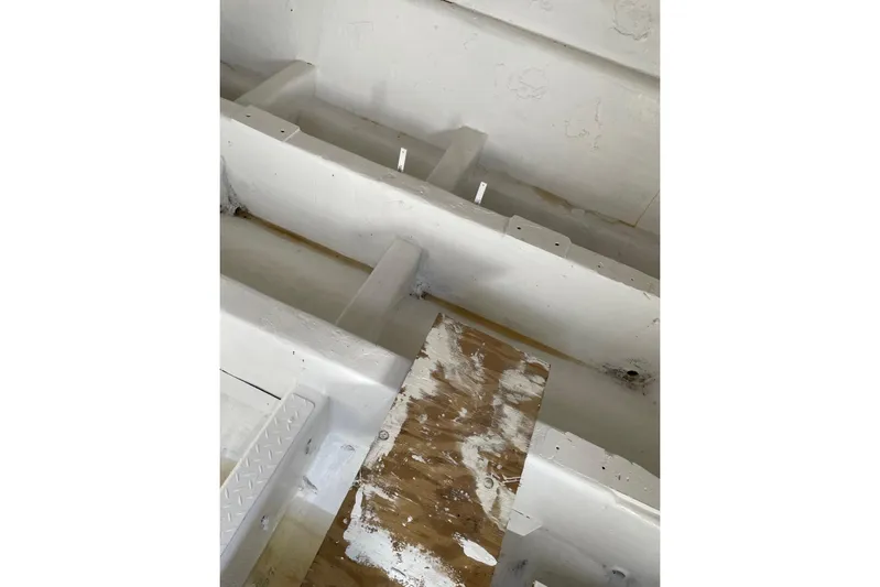 Asi Tender Yacht Photos Pics Interior view of a 1987 Commercial Buoy Tender, showing white painted surfaces and wooden elements.