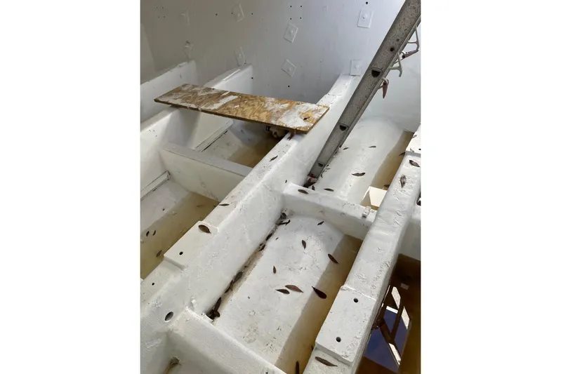 Asi Tender Yacht Photos Pics Interior view of a 1987 commercial buoy tender, showing structural framework and scattered debris.