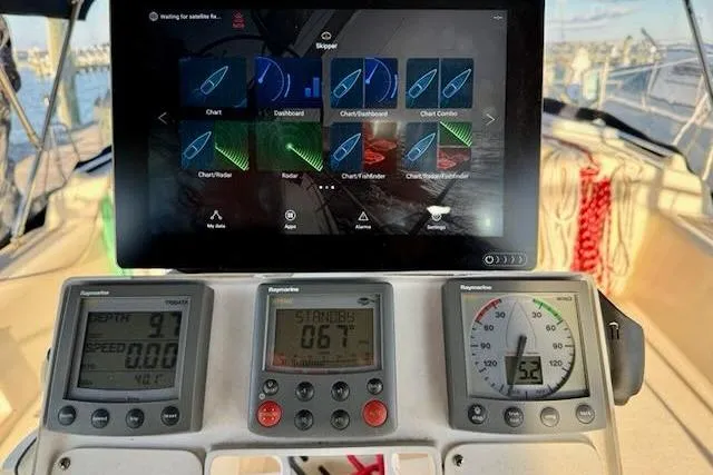 Windfall Yacht Photos Pics Cockpit of 1999 Caliber 40LRC sailboat with navigation instruments and digital display.