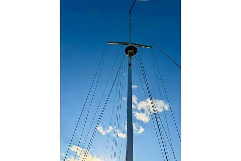 Windfall Yacht Photos Pics Sailboat mast against blue sky, Caliber 40LRC 1999 model.