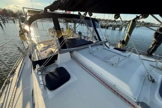 Windfall Yacht Photos Pics Sailboat Caliber 40LRC 1999 docked at marina, featuring spacious deck and cockpit.