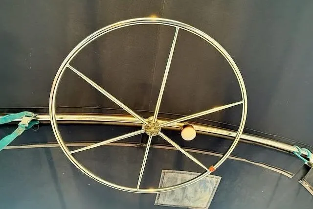 Windfall Yacht Photos Pics Stainless steel steering wheel on a 1999 Caliber 40LRC sailboat.