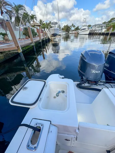  Yacht Photos Pics 2013 Edgewater 318CC boat with Yamaha 300 engine docked in a marina.