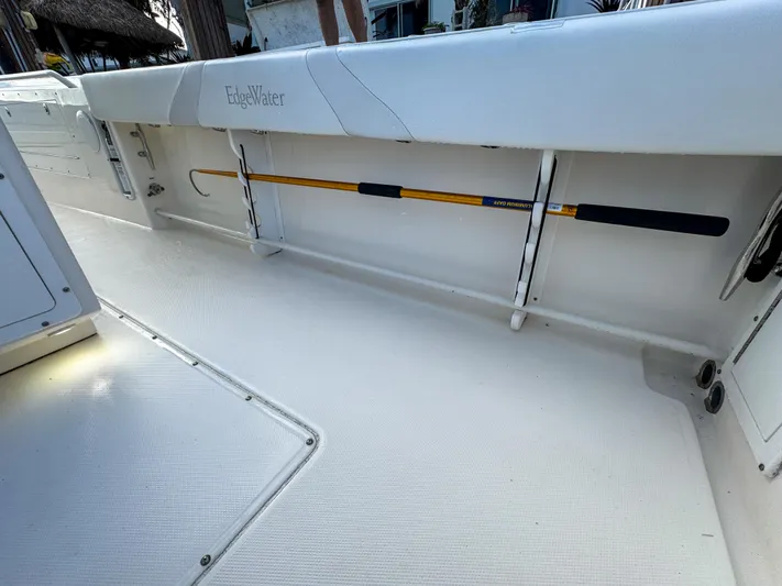  Yacht Photos Pics 2013 Edgewater 318CC boat interior with fishing rod storage.