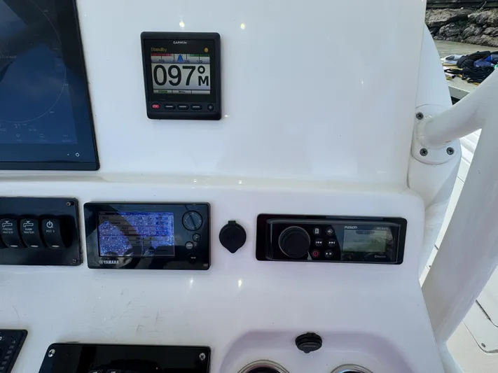 Yacht Photos Pics Control panel of a 2013 Edgewater 318CC boat with navigation instruments.