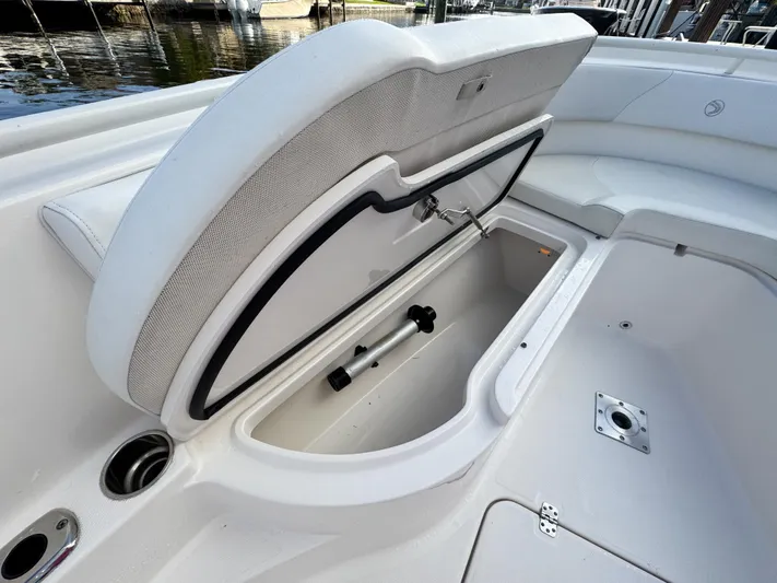  Yacht Photos Pics Open storage compartment on 2013 Edgewater 318CC boat, showcasing spacious interior design.