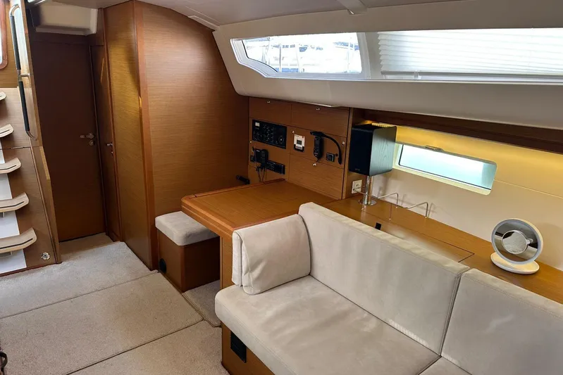  Yacht Photos Pics Interior of 2019 Jeanneau 51 yacht with modern seating and navigation equipment.