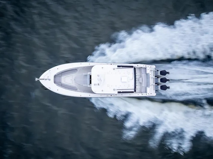 Seakeeper Equipped Yacht Photos Pics Aerial view of 2024 HCB 42 Lujo boat speeding on water.
