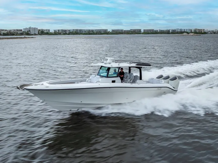 Seakeeper Equipped Yacht Photos Pics 2024 HCB 42 Lujo boat cruising on open water, showcasing sleek design and powerful engines.