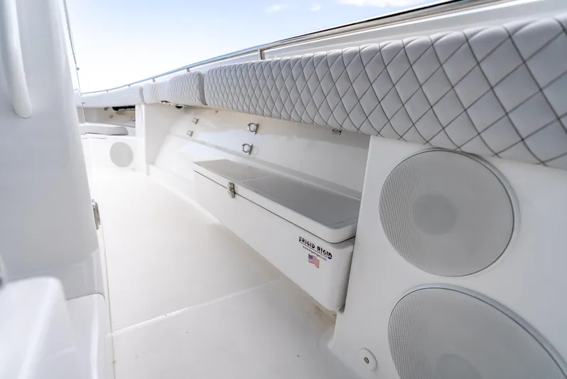 Seakeeper Equipped Yacht Photos Pics 2024 HCB 42 Lujo boat interior with cushioned seating and storage.