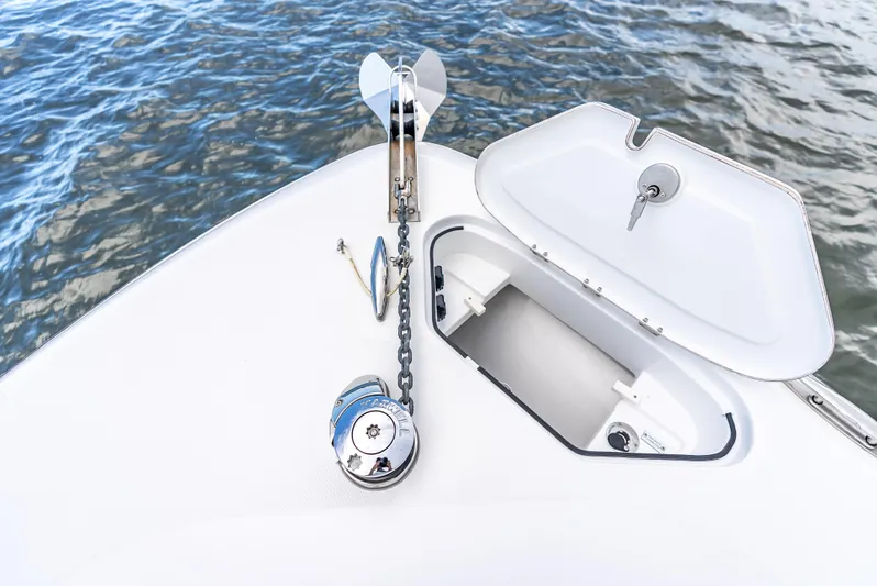 Seakeeper Equipped Yacht Photos Pics 2024 HCB 42 Lujo boat anchor system with open hatch on calm water.
