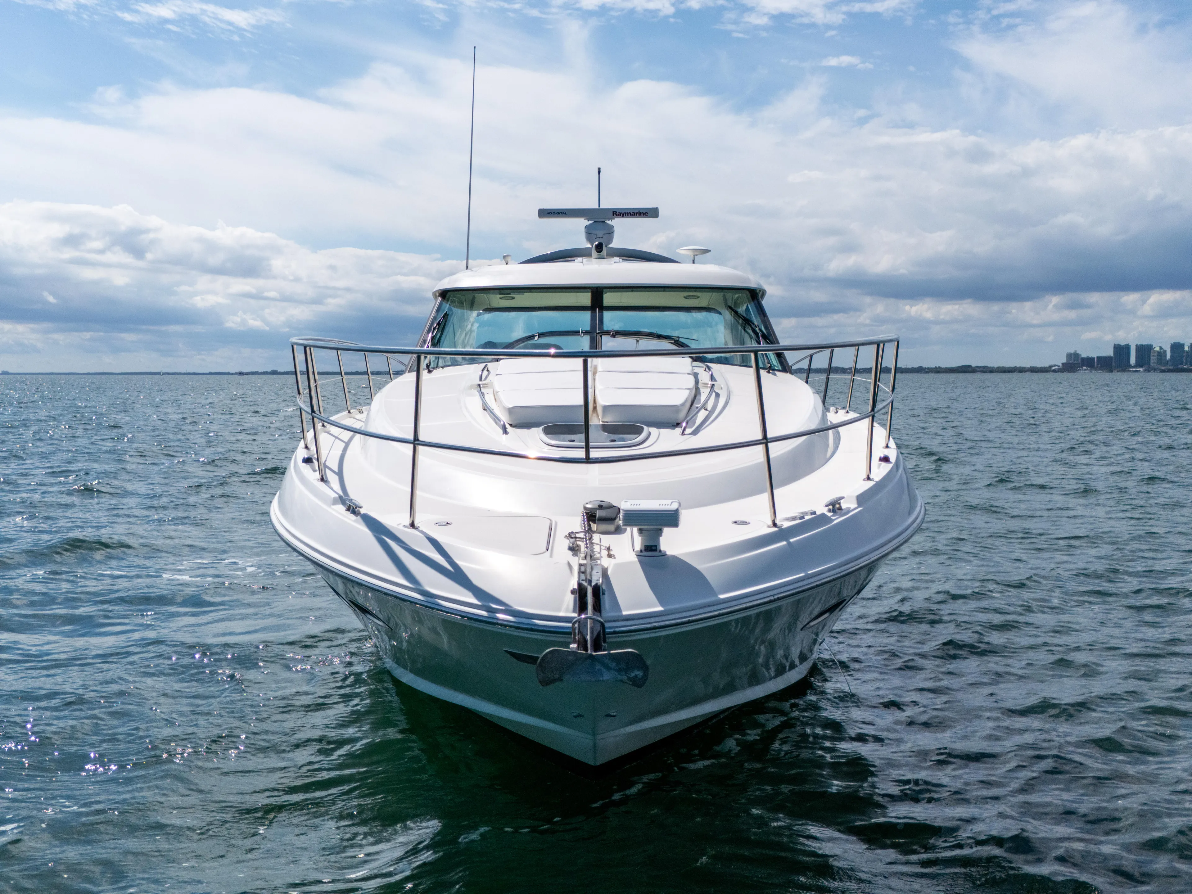  Yacht Photos Pics 2011 Sea Ray 470 Sundancer yacht on open water under a cloudy sky.