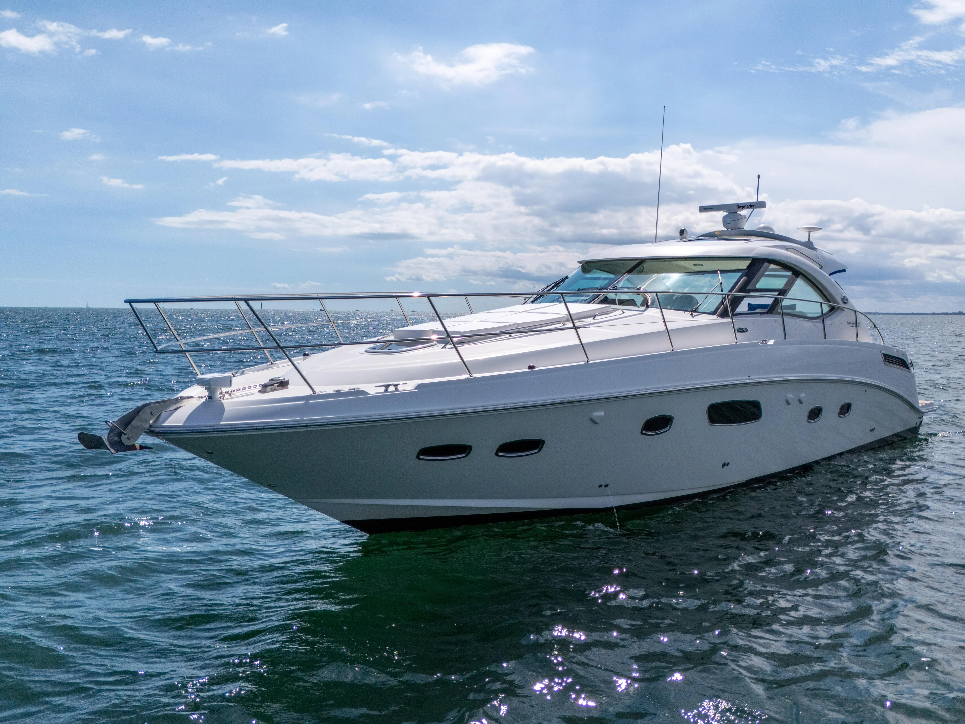  Yacht Photos Pics 2011 Sea Ray 470 Sundancer yacht cruising on open water under a clear sky.