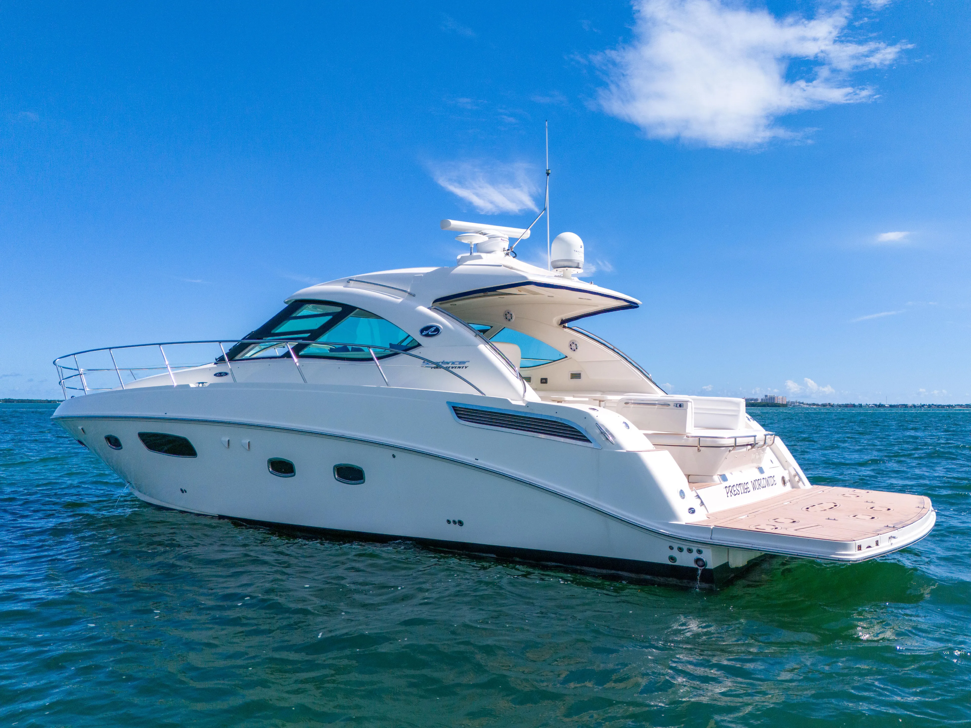  Yacht Photos Pics 2011 Sea Ray 470 Sundancer yacht on open water under clear blue sky.