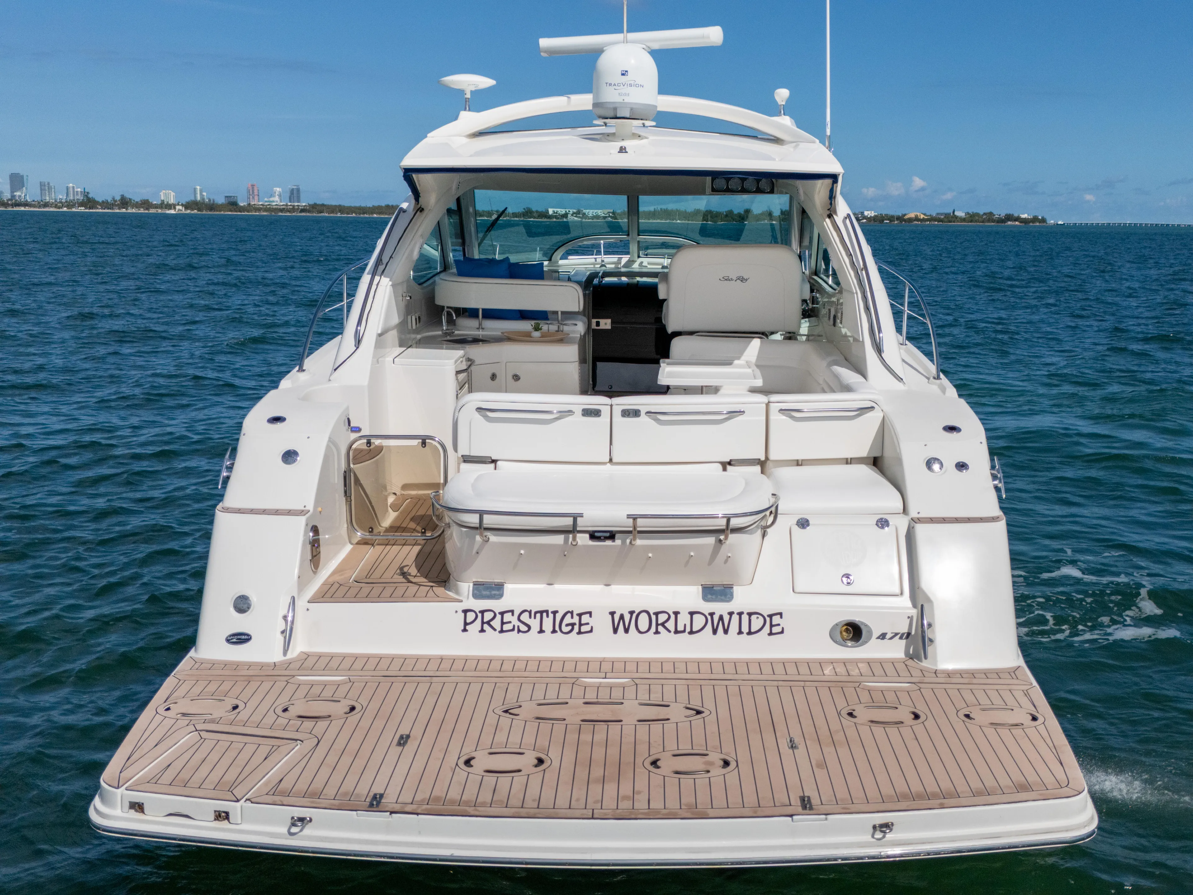  Yacht Photos Pics 2011 Sea Ray 470 Sundancer yacht on water, rear view, labeled "Prestige Worldwide."