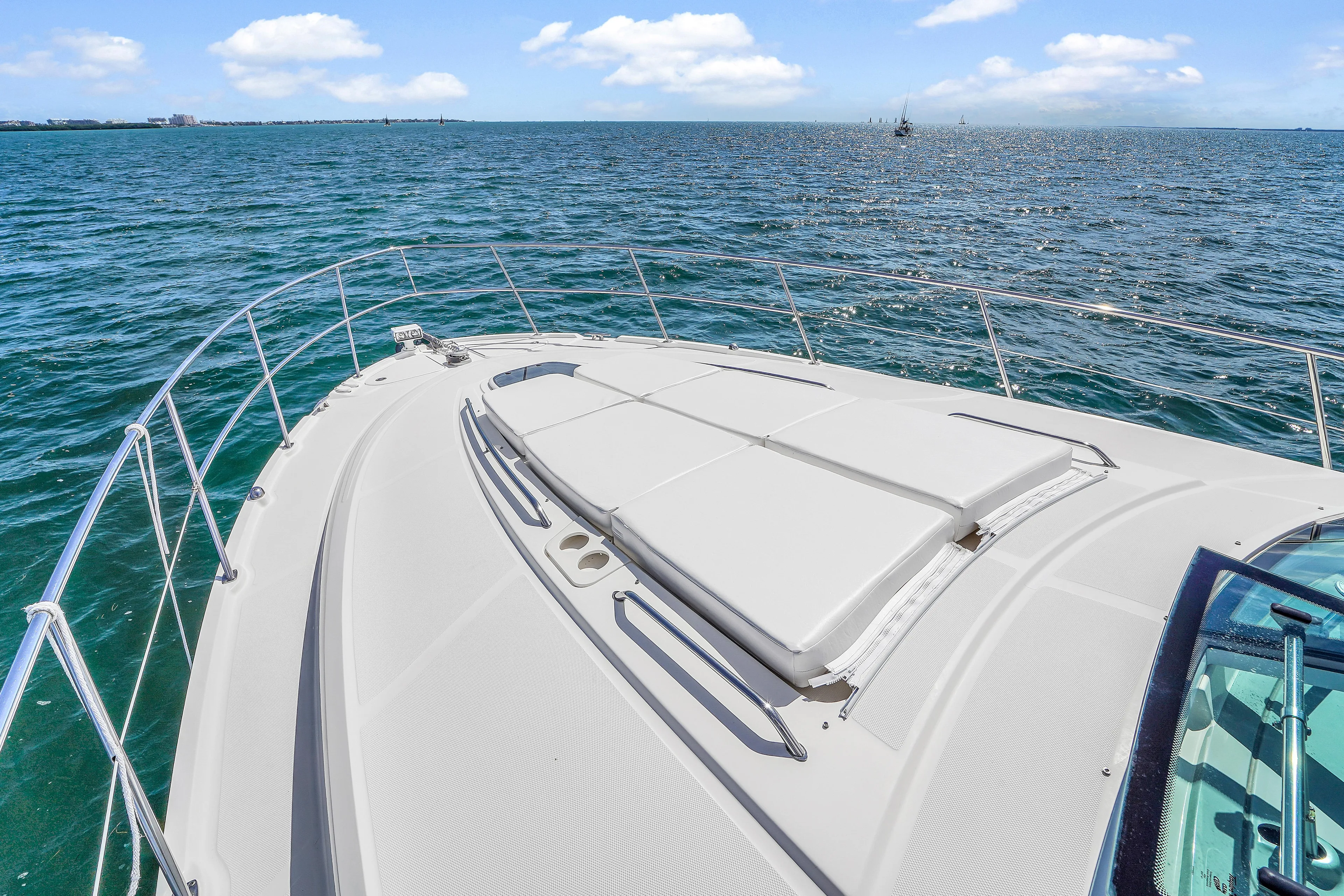  Yacht Photos Pics 2011 Sea Ray 470 Sundancer yacht on open water, showcasing sleek deck design.