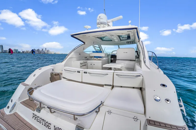  Yacht Photos Pics 2011 Sea Ray 470 Sundancer yacht on open water, featuring spacious deck and luxurious seating.