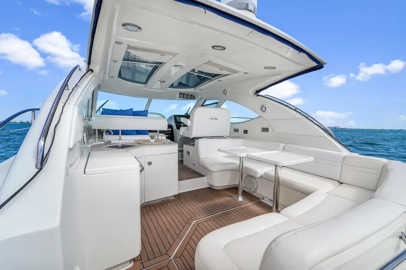  Yacht Photos Pics 2011 Sea Ray 470 Sundancer yacht interior with white seating and ocean view.