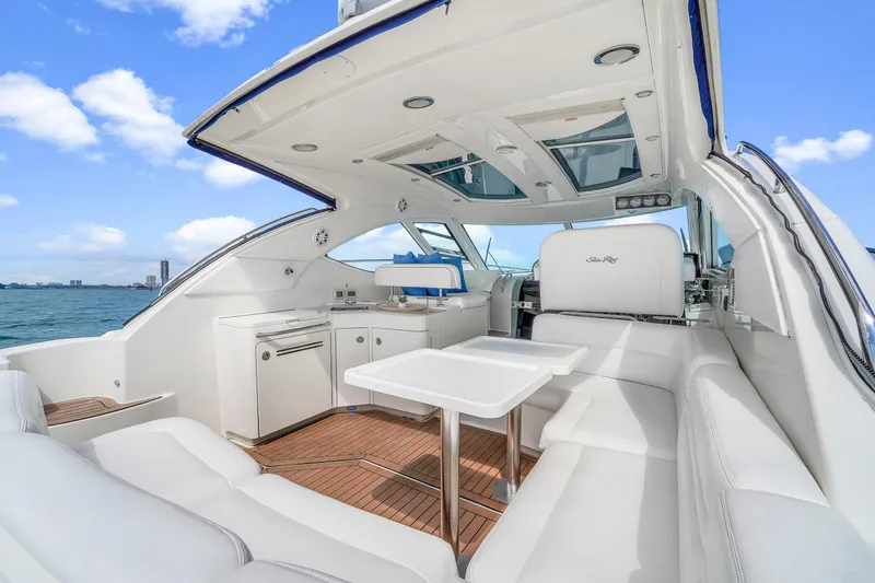  Yacht Photos Pics 2011 Sea Ray 470 Sundancer yacht interior with white seating and ocean view.