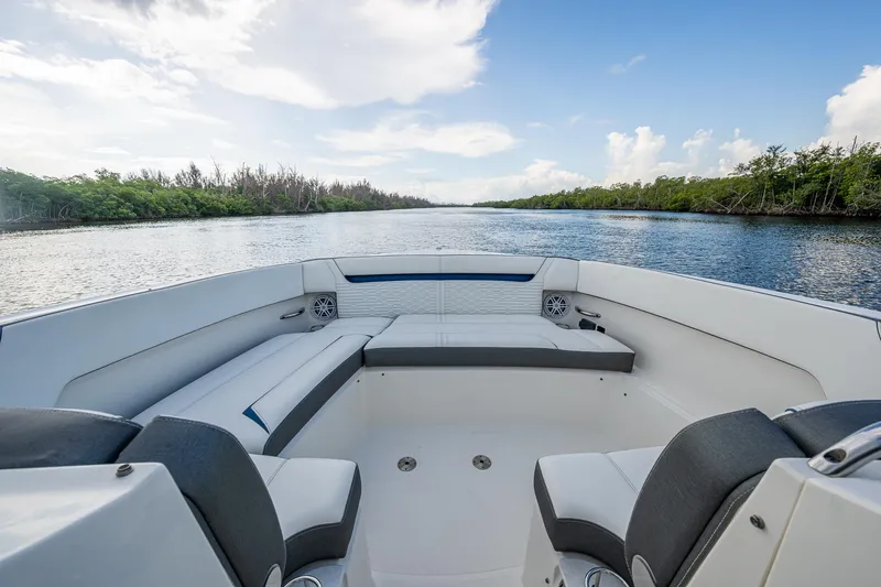  Yacht Photos Pics 2021 Tiara Yachts 38 LX boat interior with seating, on a scenic waterway.