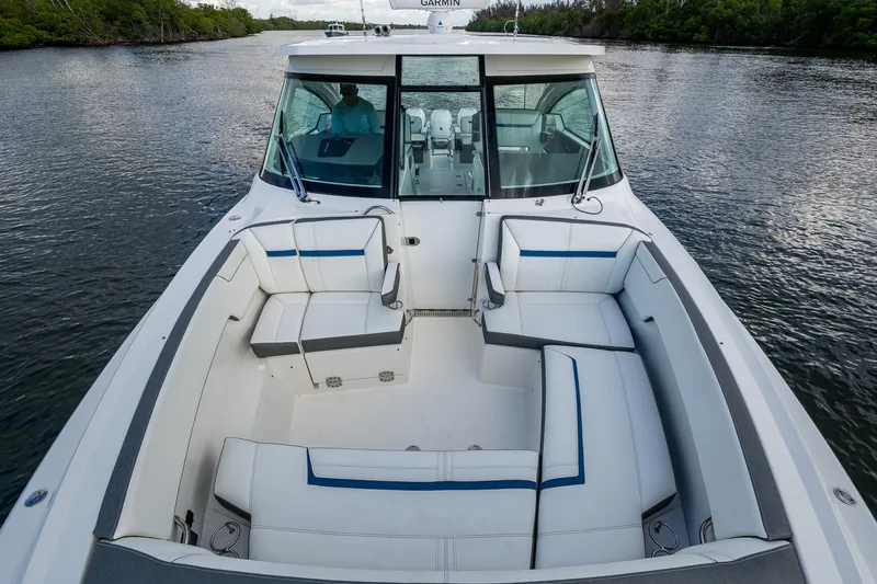  Yacht Photos Pics 2021 Tiara Yachts 38 LX with spacious seating on a calm waterway.