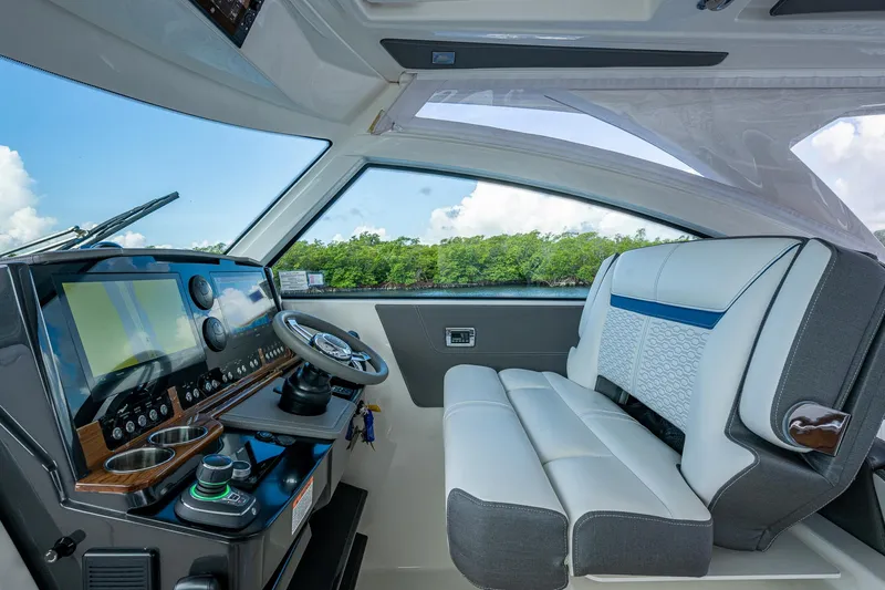  Yacht Photos Pics 2021 Tiara Yachts 38 LX helm with modern controls and luxurious seating.