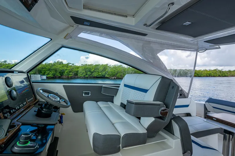  Yacht Photos Pics 2021 Tiara Yachts 38 LX helm with luxurious seating and advanced navigation system.