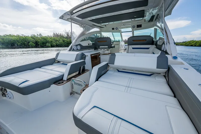  Yacht Photos Pics 2021 Tiara Yachts 38 LX luxury boat interior with plush seating and scenic water view.