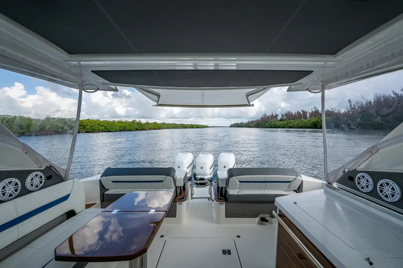  Yacht Photos Pics 2021 Tiara Yachts 38 LX interior with scenic waterway view.