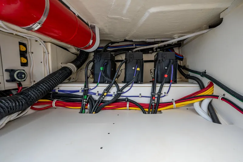  Yacht Photos Pics Engine compartment of 2021 Tiara Yachts 38 LX, showcasing wiring and components.