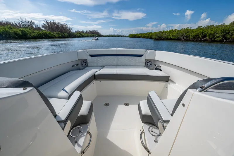  Yacht Photos Pics 2021 Tiara Yachts 38 LX interior with seating, on a scenic waterway.