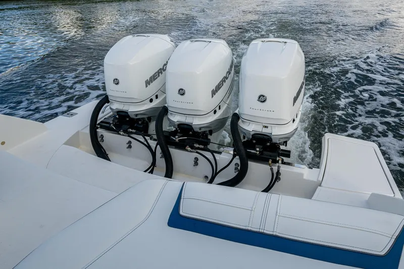  Yacht Photos Pics Triple Mercury outboard engines on 2021 Tiara Yachts 38 LX, cruising on water.