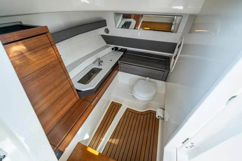 Yacht Photos Pics 2021 Tiara Yachts 38 LX interior with modern bathroom, wooden accents, and sleek design.