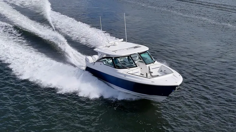  Yacht Photos Pics 2021 Tiara Yachts 38 LX cruising on open water, showcasing sleek design and performance.