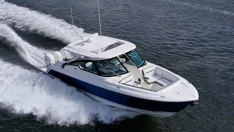  Yacht Photos Pics 2021 Tiara Yachts 38 LX cruising on open water, showcasing sleek design and powerful performance.