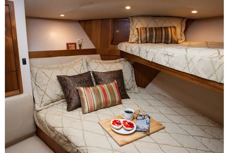  Yacht Photos Pics Manufacturer Provided Image: Cozy cabin interior of 2018 Albemarle 36 Express with double bed and bunk.