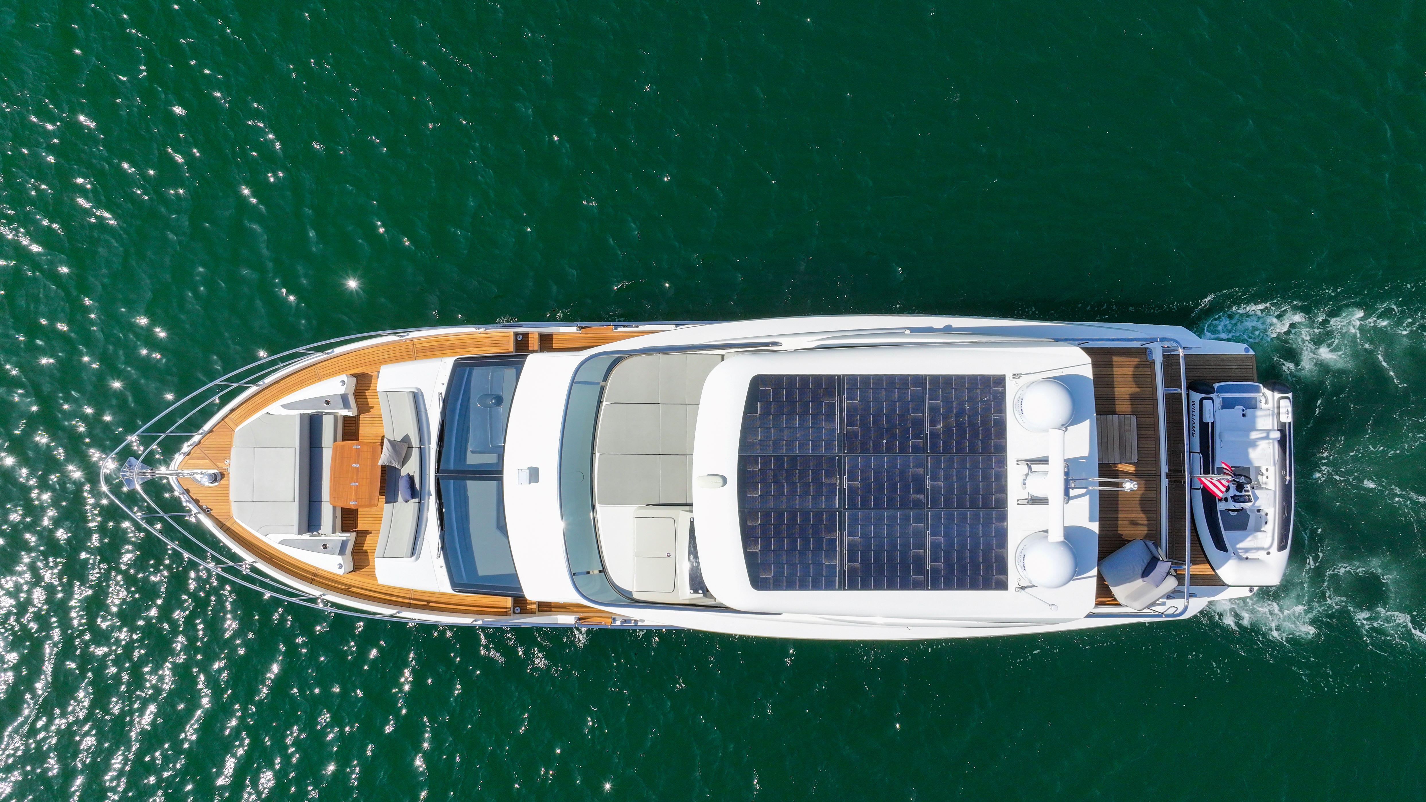 Aerial view of 2024 Absolute 60 Fly Co Ownership yacht cruising on open water.