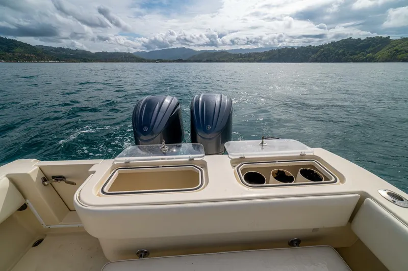 D Flawless Yacht Photos Pics 2007 Contender 33 boat with dual engines on a scenic lake.