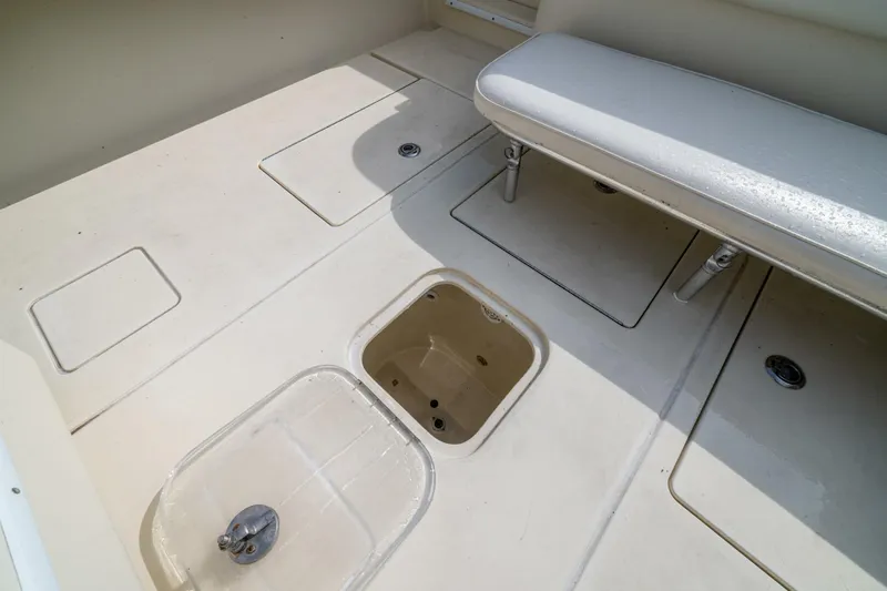 D Flawless Yacht Photos Pics 2007 Contender 33 boat interior with storage compartments and seating.