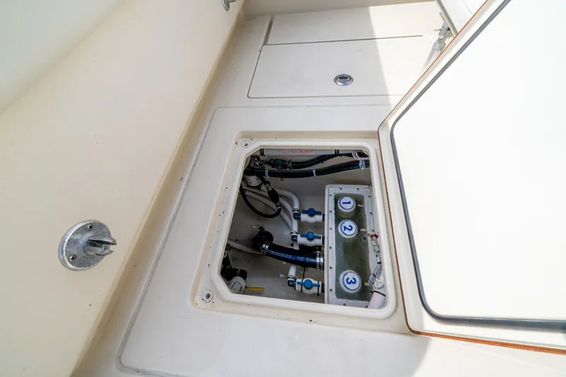 D Flawless Yacht Photos Pics 2007 Contender 33 boat compartment with visible wiring and components.