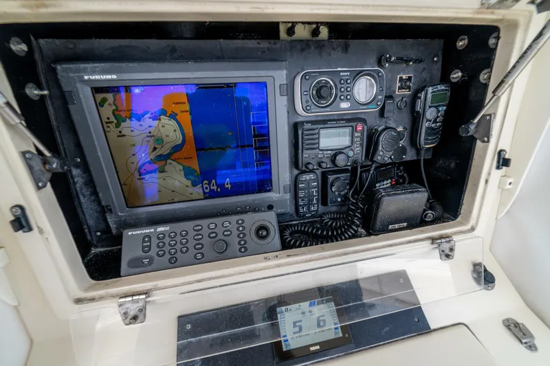 D Flawless Yacht Photos Pics Control panel of a 2007 Contender 33 boat with navigation and communication equipment.