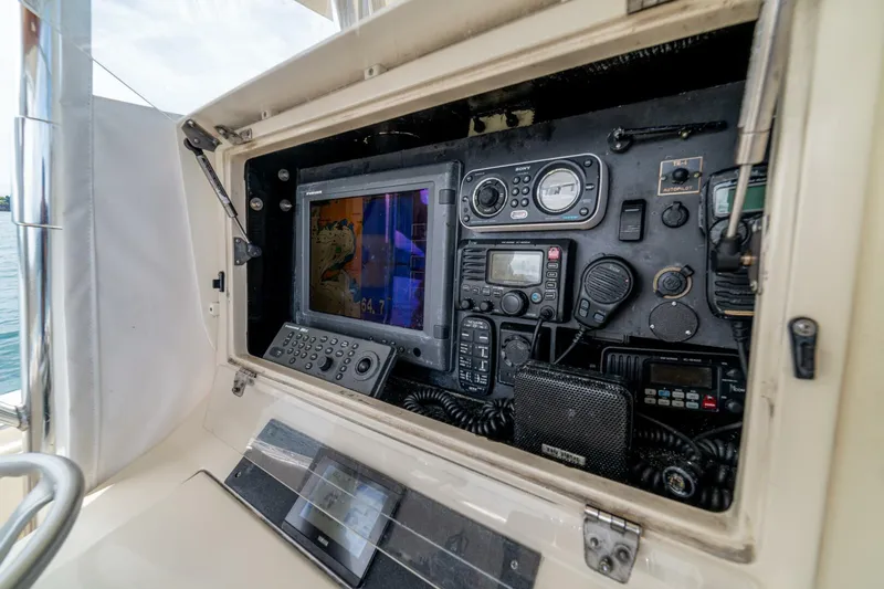 D Flawless Yacht Photos Pics Control panel of a 2007 Contender 33 boat with navigation and communication equipment.