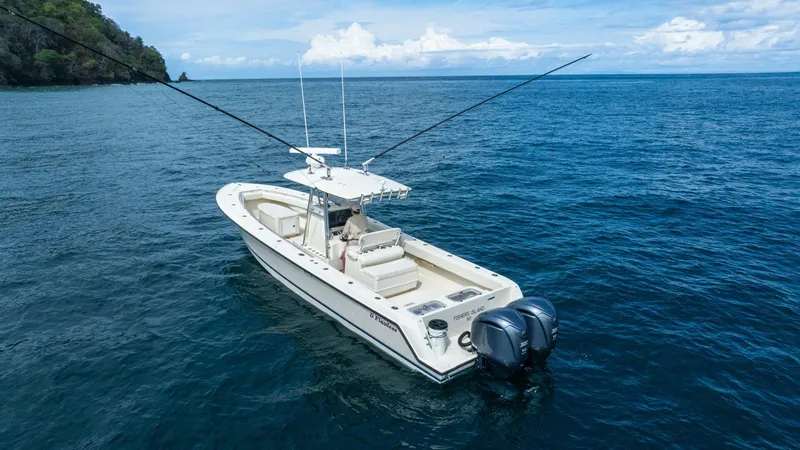 D Flawless Yacht Photos Pics 2007 Contender 33 boat on open sea with dual engines and fishing rods.