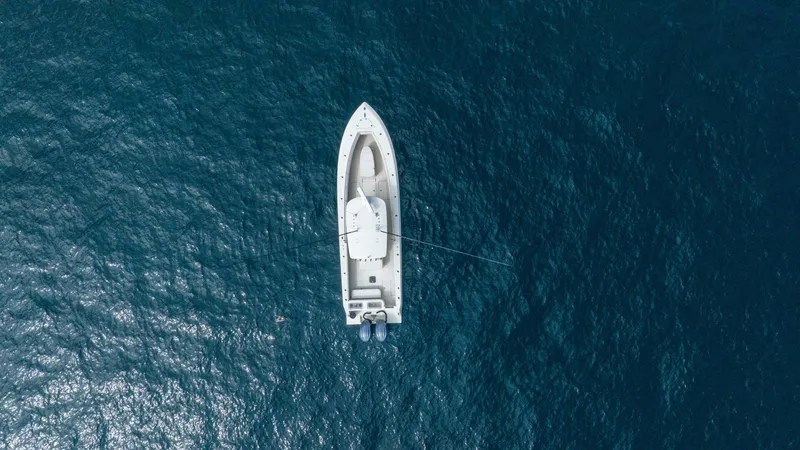 D Flawless Yacht Photos Pics Aerial view of 2007 Contender 33 boat on open blue sea.