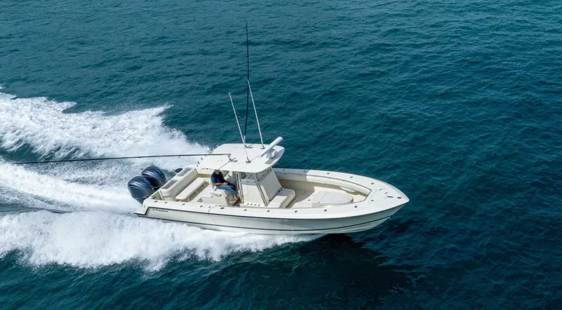 D Flawless Yacht Photos Pics 2007 Contender 33 boat cruising on open water with dual engines.