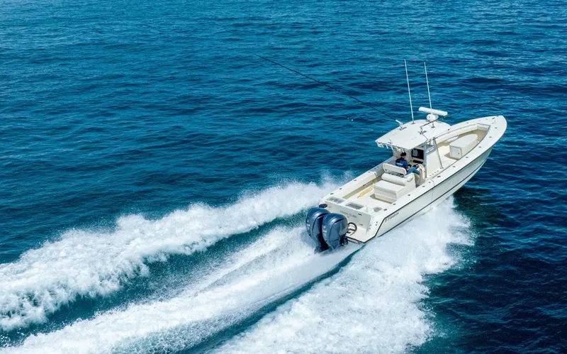 D Flawless Yacht Photos Pics 2007 Contender 33 boat cruising on open blue ocean waters.